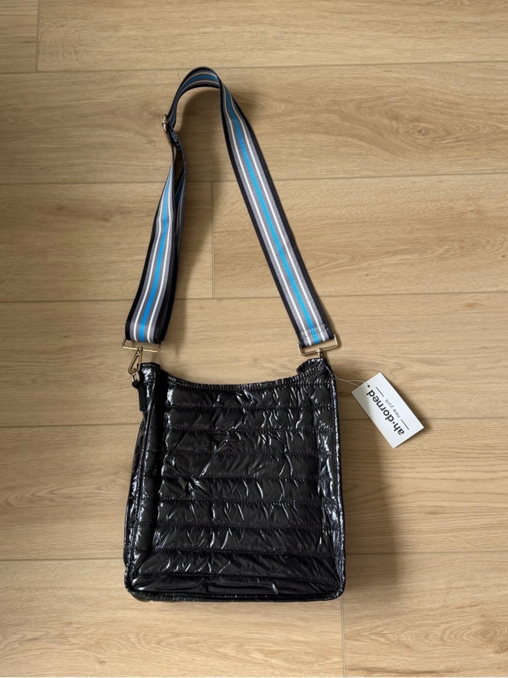 Black Quilted Crossbody Bag with Striped Adjustable Strap